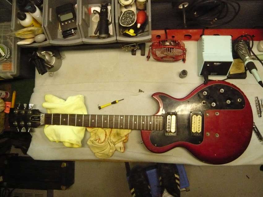 Guitar setup on a workbench