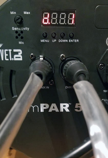 The fixture's DMX input and output.