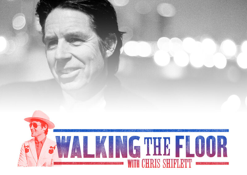 Black and white portrait of a man against blurred lights with Walking the Floor graphic.