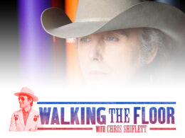 Man wearing light-colored cowboy hat against vibrant purple and orange gradient background.