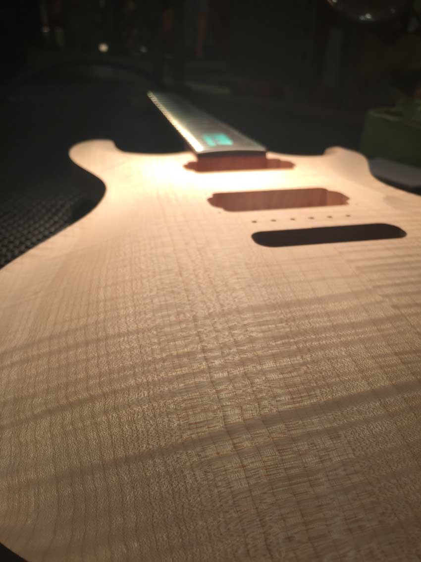 Beautiful wood grain on this unfinished guitar. Photo credit: Sergio C.