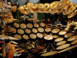 Terry Bozzio's massive custom drum kit with multiple drums and cymbals arranged on a dark stage.