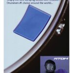 Blue Moongel damping pad on drum rim next to product package.