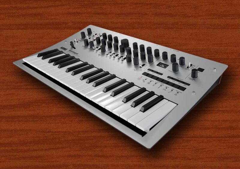 Silver Korg Minilogue polyphonic synthesizer keyboard with control knobs and interface panel.