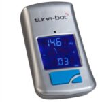 A silver Pearl tune-bot chromatic tuner displays frequency information on screen.