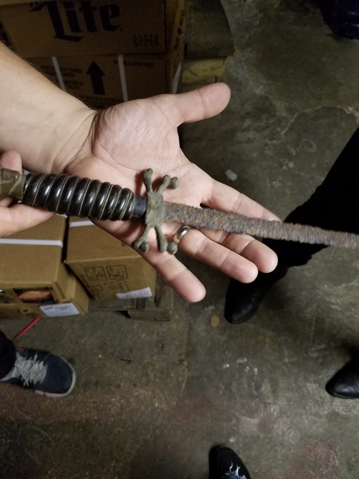 The owner of the Tonic Room shows us a rusty dagger found in the "haunted basement".