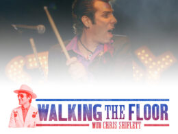 Singer performing on stage during Walking the Floor concert with Chris Shiflett.