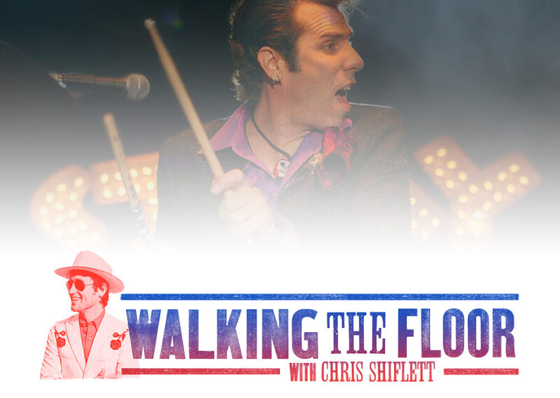 Singer performing on stage during Walking the Floor concert with Chris Shiflett.