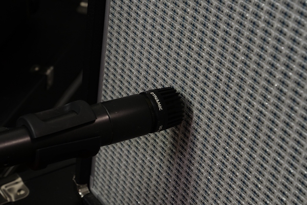 SM57 on Fender amp grille