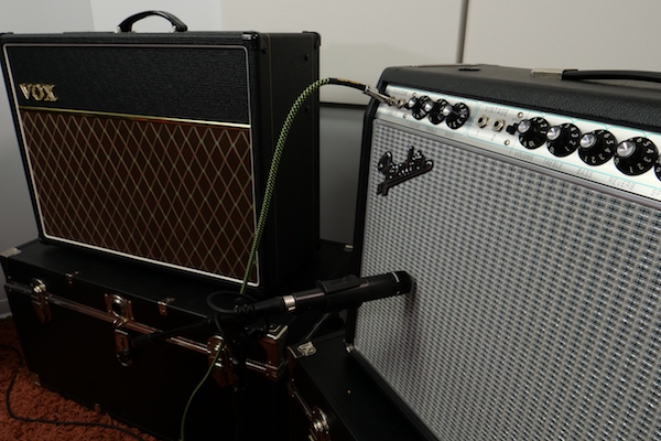 SM57 on Fender amp with Vox amp in background