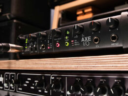 The IK Multimedia AXE I/O audio interface on a professional workstation.