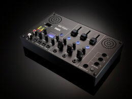 Korg Volca Mix compact synthesizer with knobs, sliders, buttons, and display.