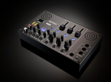 Korg Volca Mix compact synthesizer with knobs, sliders, buttons, and display.