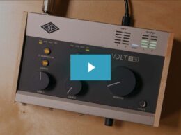 Universal Audio VOLT audio interface with analog control knobs, LED level meters, and wooden frame.