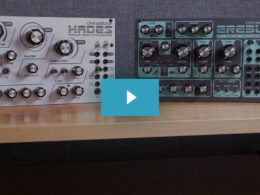 Light Hades and dark Erebus Dreadbox synthesizer modules sit side by side on a wooden desk.