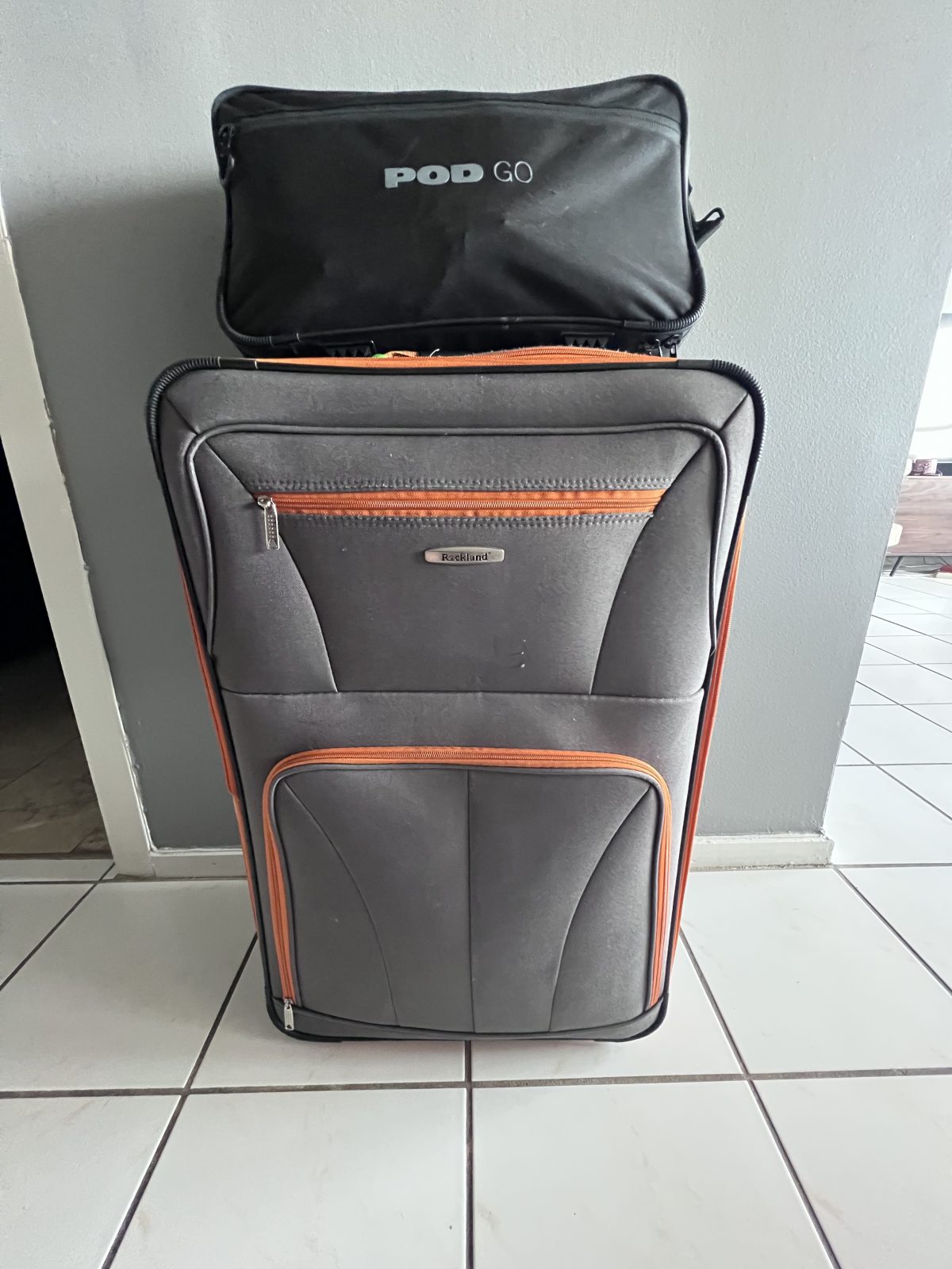 Line 6 Pod GO in shoulder bag atop luggage