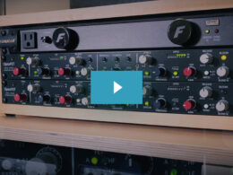Two OptoFET audio compressors mounted in a wooden rack, featuring red and gray control knobs and green LED indicators.