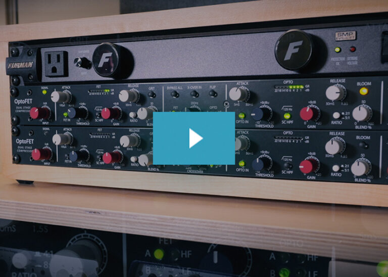 Two OptoFET audio compressors mounted in a wooden rack, featuring red and gray control knobs and green LED indicators.