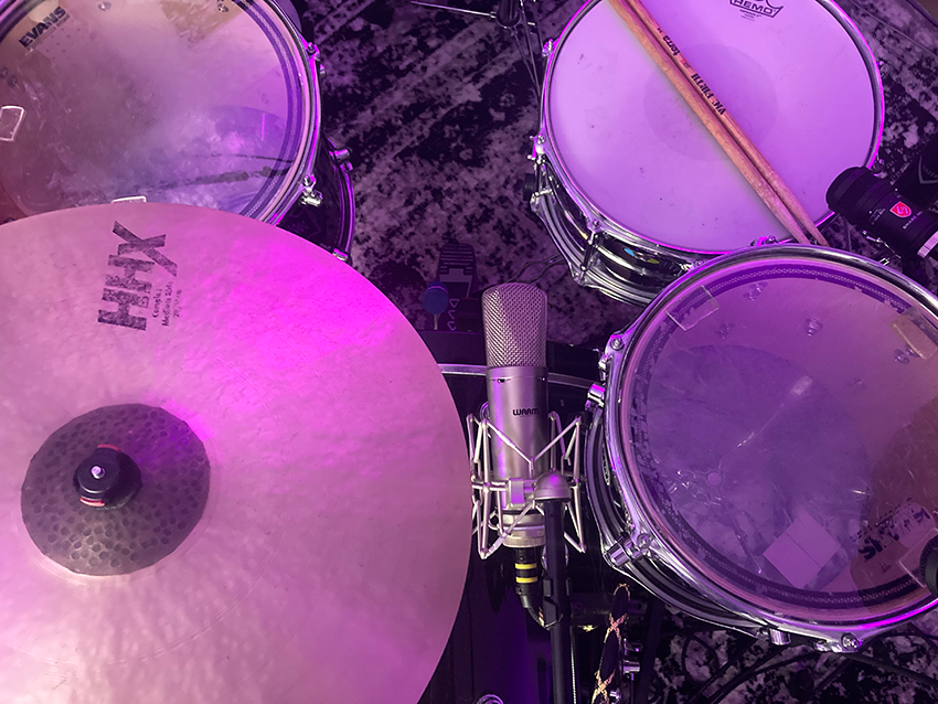 Tracking pristine raw stems is vital for the re-amping process to go on without a hitch. Here we have a Warm Audio WA-87 R2 set to "omni" mode in the Würst position on the drum kit.